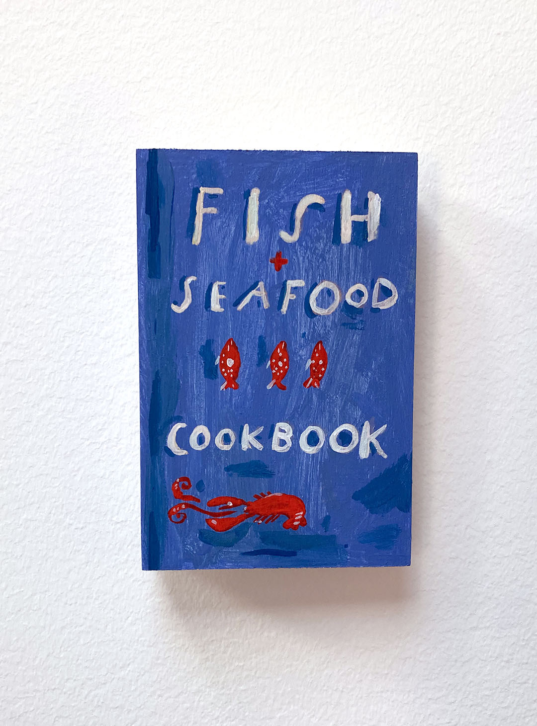 Fish + Seafood Cookbook, painting on wood block.