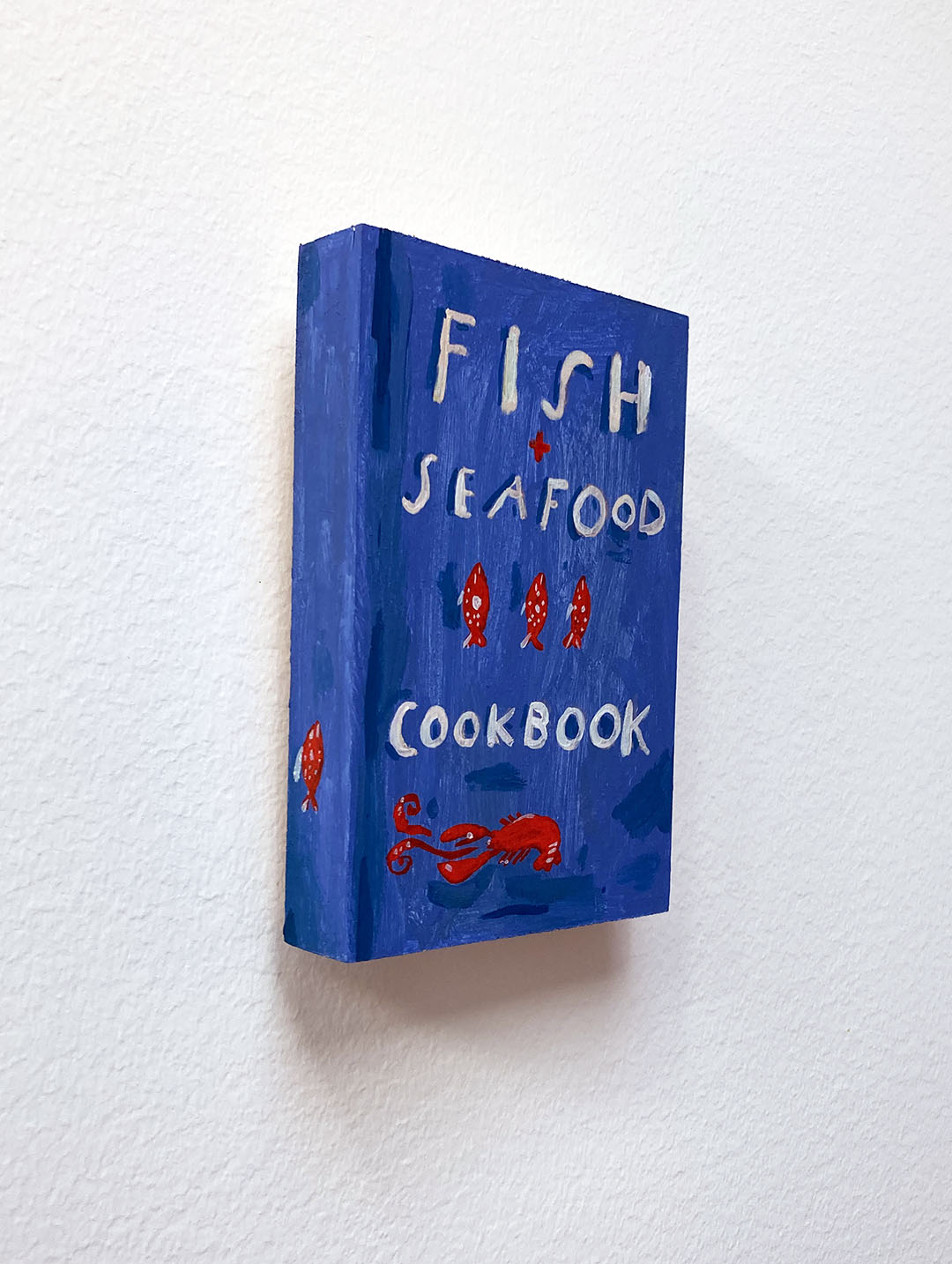Fish + Seafood Cookbook, painting on wood block.
