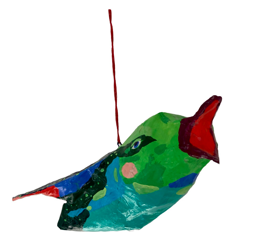 Flying colorful bird, paper mache