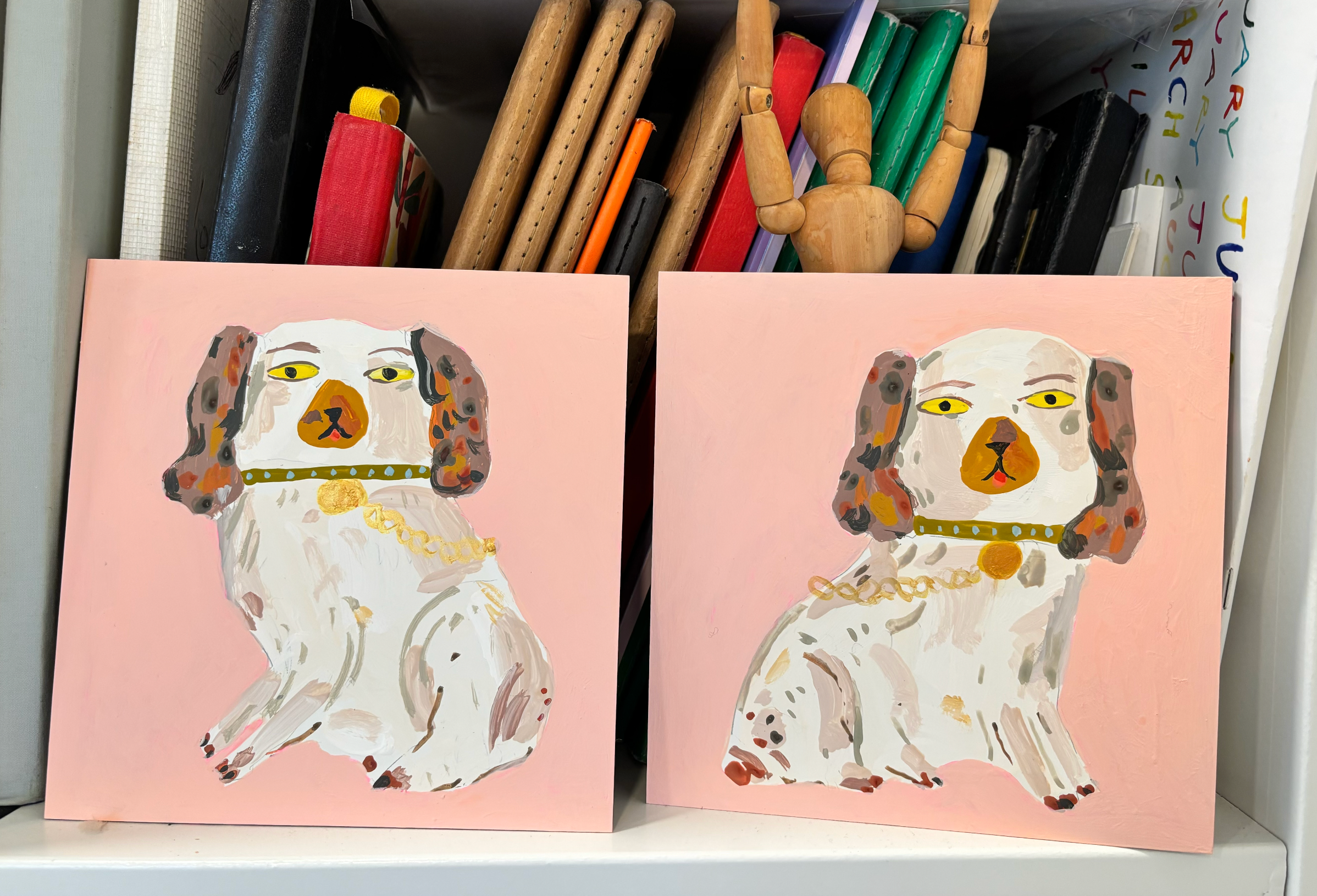 Staffordshire dog statues, coral pink and brown