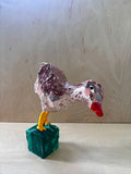 Paper mache bird statue