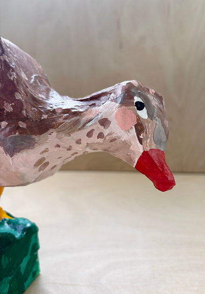 Paper mache bird statue