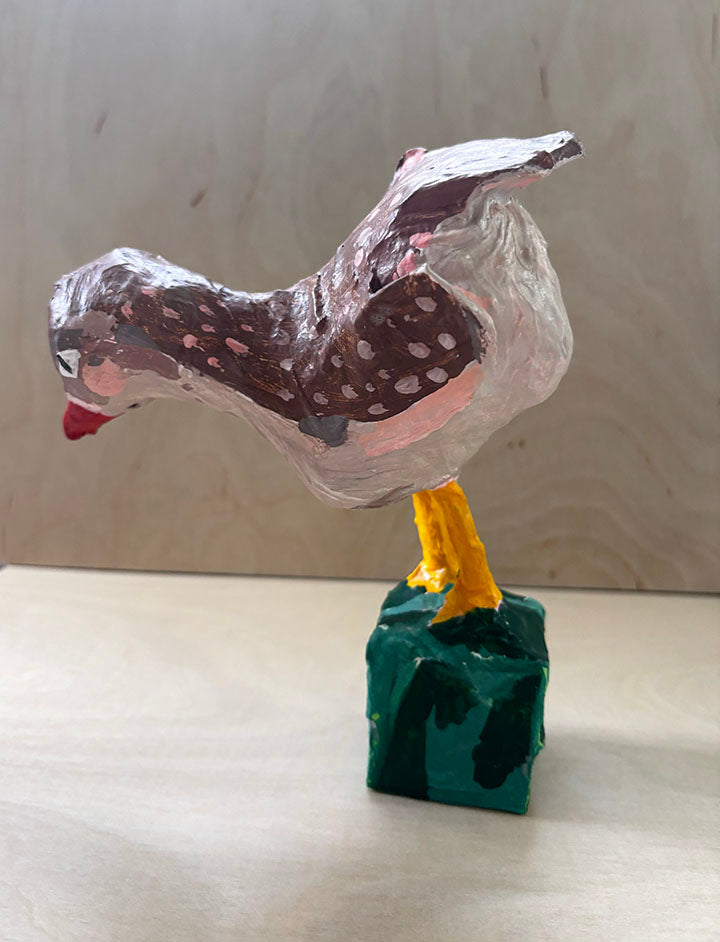Paper mache bird statue