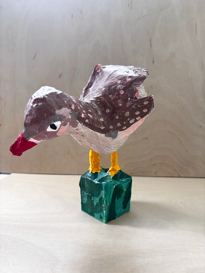 Paper mache bird statue