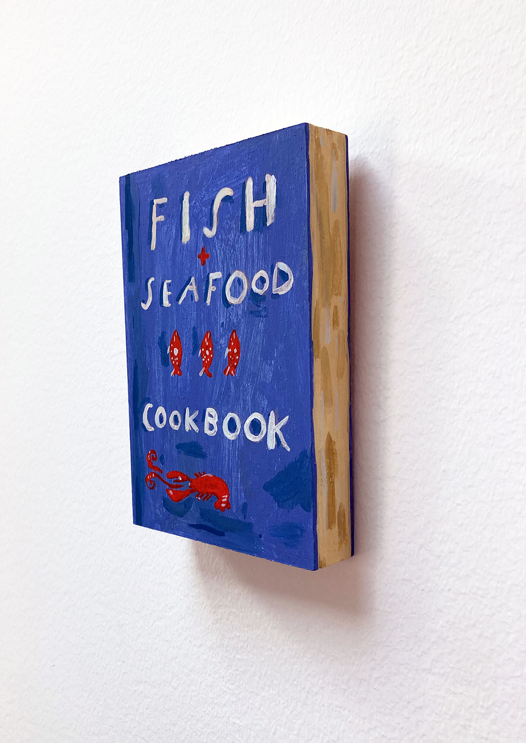 Fish + Seafood Cookbook, painting on wood block.